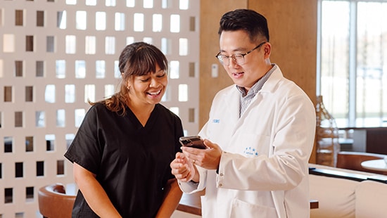 Hotel employee looking at On-Demand Digital Training with an Ecolab Expert