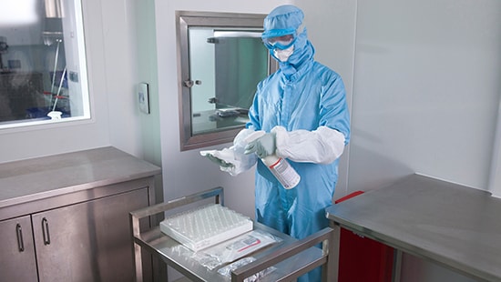 Cleanroom technician using Ecolab Klercide™ product