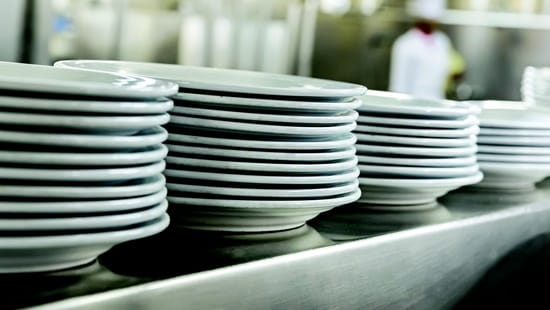 Clean plates stack in a row