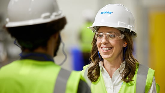 Ecolab expert smiling at another person