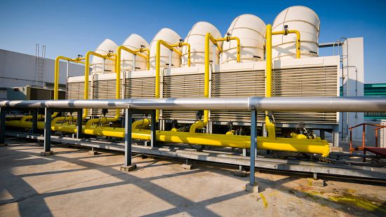 Rooftop cooling unit with chiller units and compressors.